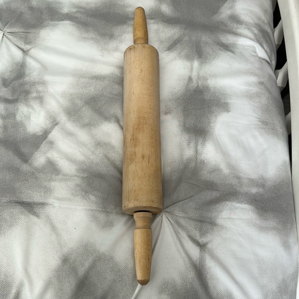 Vintage solid wood rolling pin with independent handheld grips.